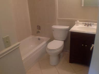Bathroom with pedestal sink and tub
