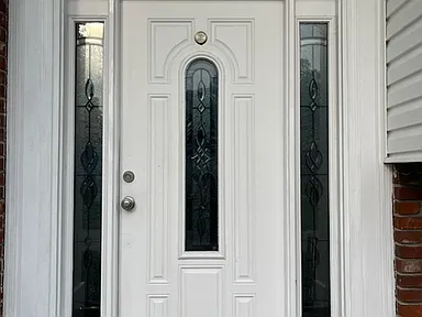 Front entry door with decorative glass sidelights